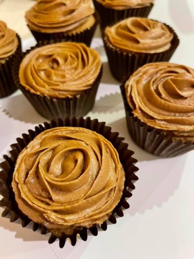 Whyte's Bakery Cupcakes Chocolate cupcakes with creamy swirled frosting, arranged on a light background.
