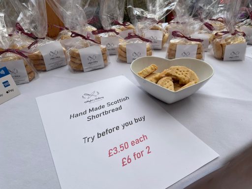 Whyte's Bakery Christmas Market A display of shortbread biscuits with a sign indicating prices and tasting offer.