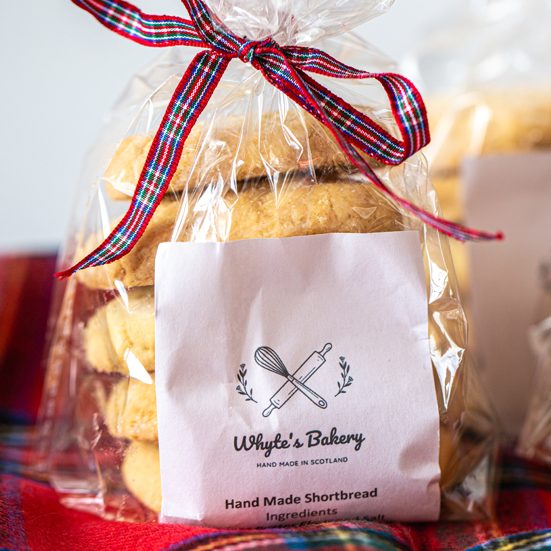 Highlanders Traditional Shortbread A clear bag of handmade shortbread tied with a ribbon, labelled "Whyte's Bakery."