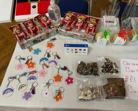 Whyte's Bakery Christmas Market A display of craft items including keychains, charms, and festive decorations.